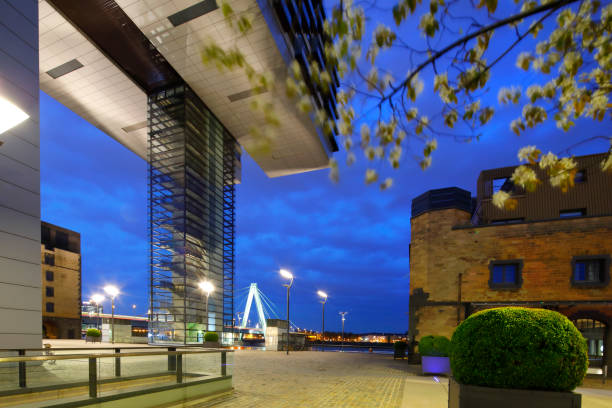 Crane Buildings (Kranhäuser) at the Rheinau Harbor (Rheinauhafen) at night, Cologne The redeveloped former industrial harbor Rheinau Harbor with a mixture of spectacular post-modern building and old warehouses at night. cuboidal epithelium stock pictures, royalty-free photos & images