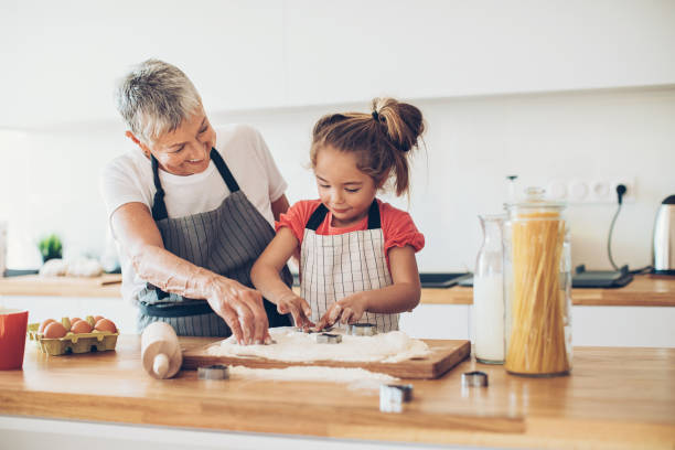 istock Helping grandma with the cookies! 663982096