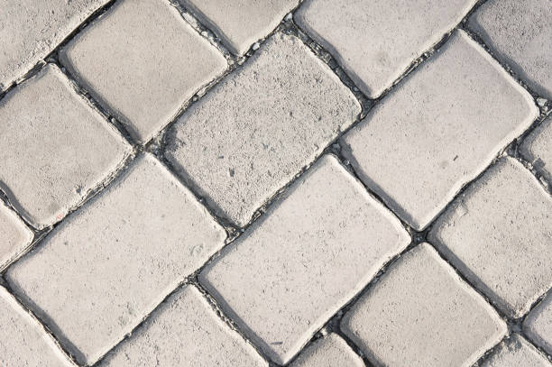 istock pavement texture , paving stone ,stone block, brick fotpath background 663984562