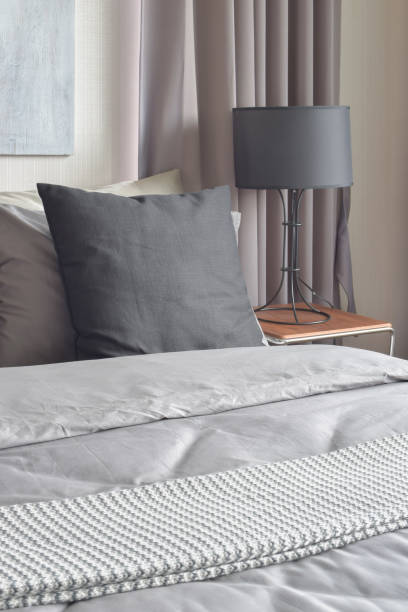 istock Black pillows setting on gray color scheme bedding bedroom interior 663984818