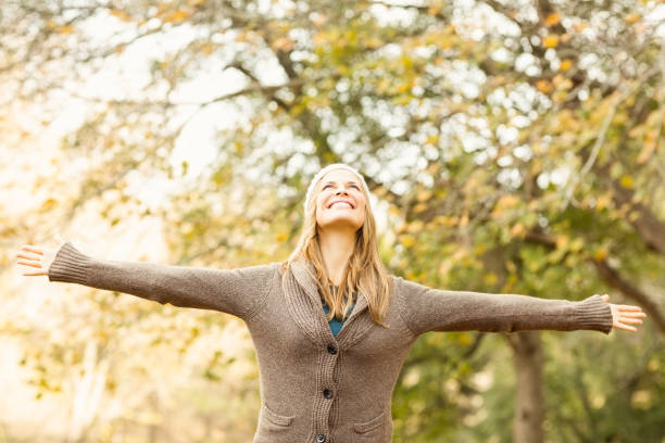 istock Smiling pretty woman with arms outstretched 663994936