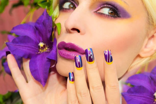 istock Summer purple yellow makeup and manicure. 664007160