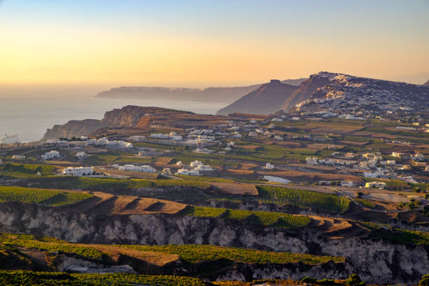 Landscape view of fields, vineyards and greek villages on Santorini Landscape view of fields, vineyards and greek villages Fira and Oia on Santorini island, Greece santorin stock pictures, royalty-free photos & images
