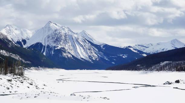 istock frozen lake and mountains covered with snow in National Park 664010918