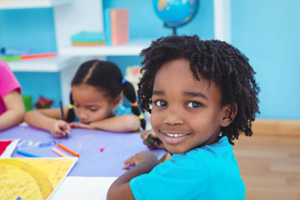 istock Children drawing on coloured paper 664015600