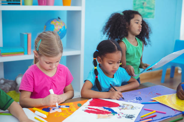 istock Happy kids all drawing pictures 664016008