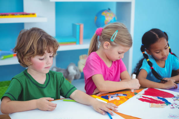istock Happy kids all drawing pictures 664016084