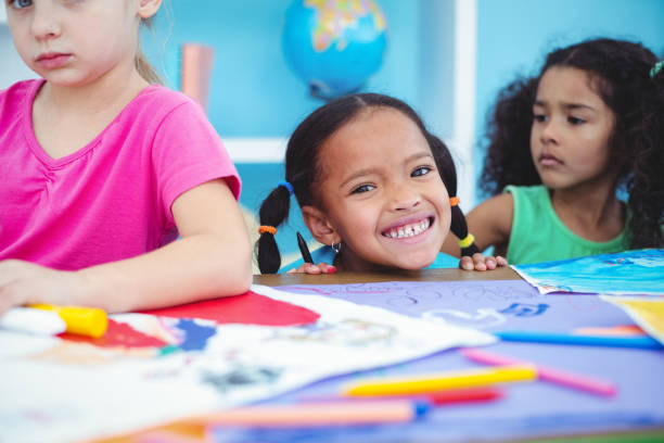 istock Happy kids all drawing pictures 664018380