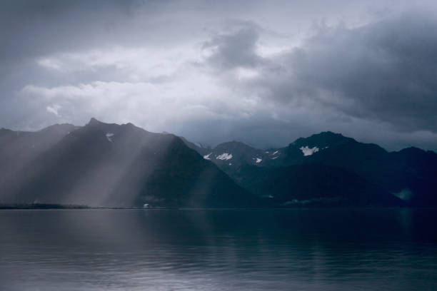 istock Rays of Light Over Mountains and Ocean 664018790