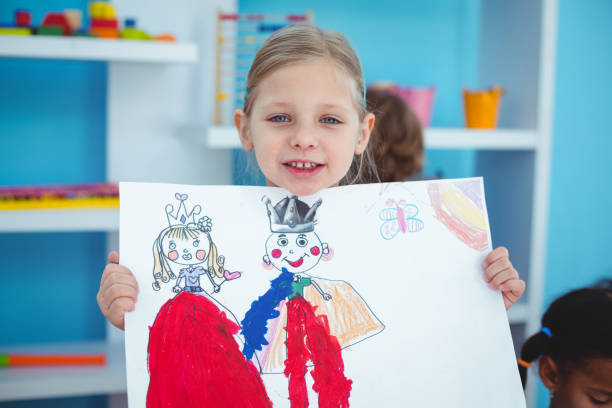istock Small girl holding a lovely drawing 664019114