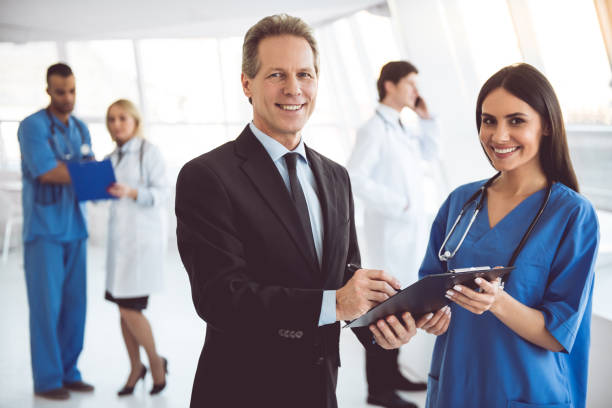 istock Doctor and businessman 664025556