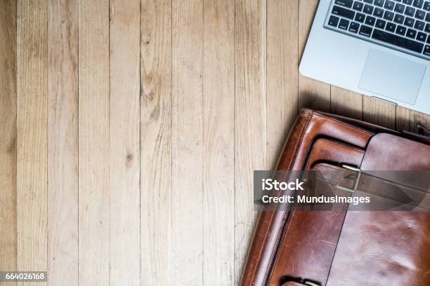 Laptop And Briefcase On A Desk From Above Stock Photo - Download Image Now - Briefcase, Table, Satchel - Bag