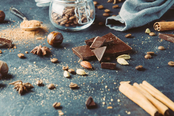 istock Coffee beans and spices on dark background 664029090