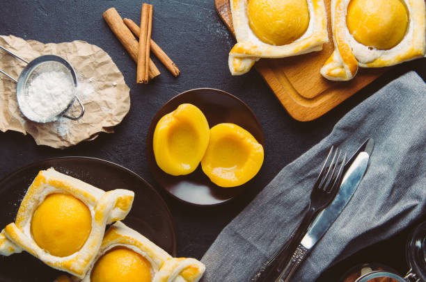 istock Peach pie and the ingredients. Shooting in the dark style 664029098