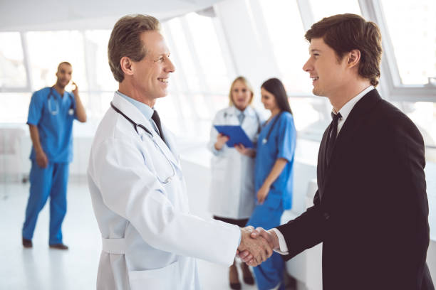 istock Doctor and businessman 664029146