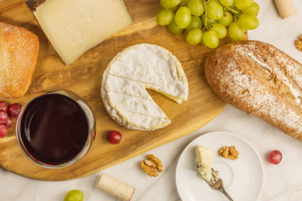 istock Red wine, cheese, bread and grapes at tasting 664029478