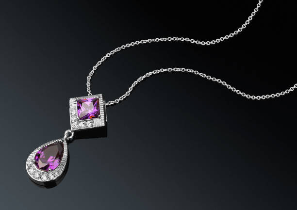 istock jewelry pendant with gems on darck background 664029832