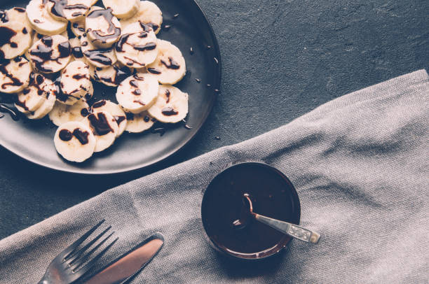 istock Banana with chocolate sauce 664029916