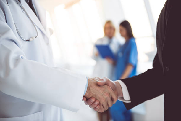 istock Doctor and businessman 664032224
