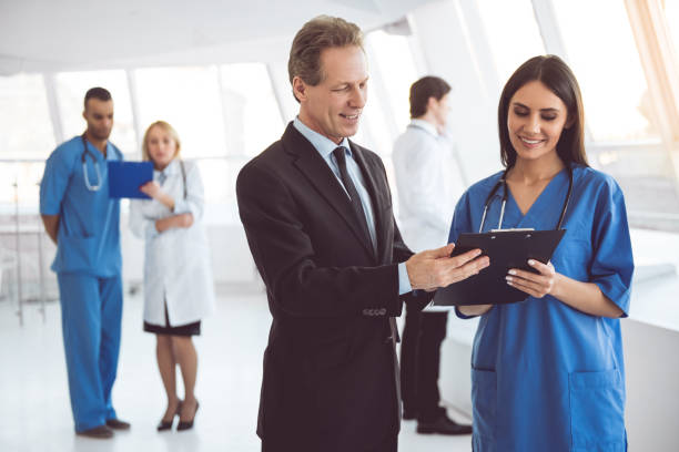 istock Doctor and businessman 664032248