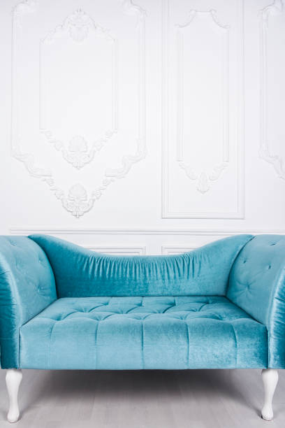 istock Blue sofa in white interior and gray floor 664035516