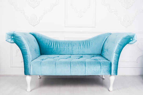 istock Blue sofa in white interior and gray floor 664035566