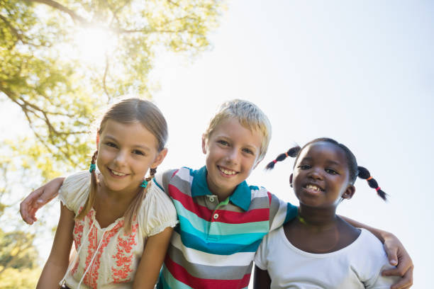 istock Kids posing together during a sunny day at camera 664040002