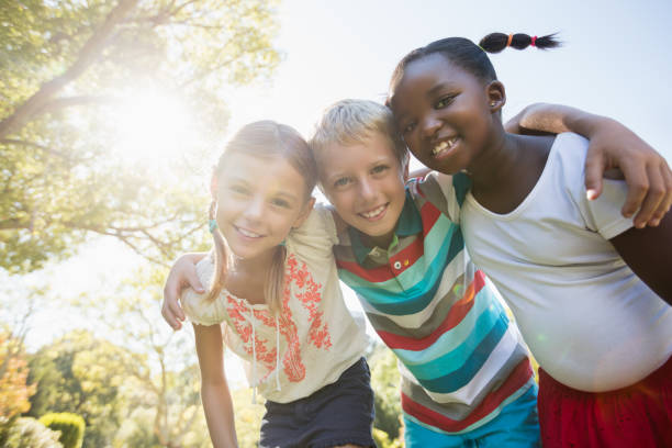 istock Kids posing together during a sunny day at camera 664040130
