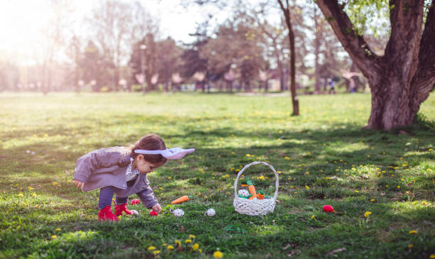 istock Little girl collecting eggs on Easter 664043678
