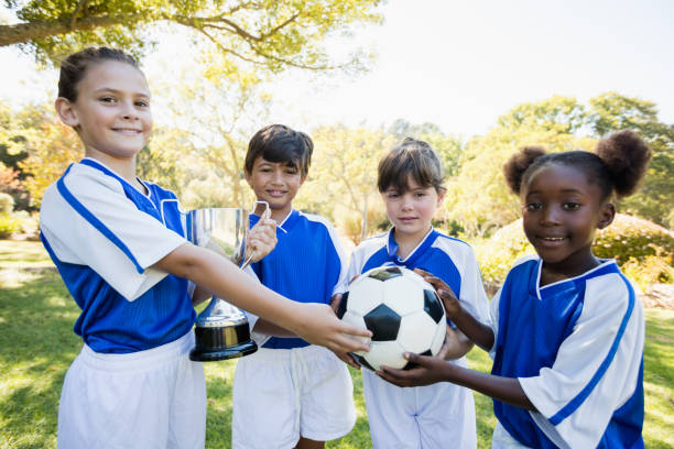 istock Winner kids posing together during a sunny day at camera 664043992