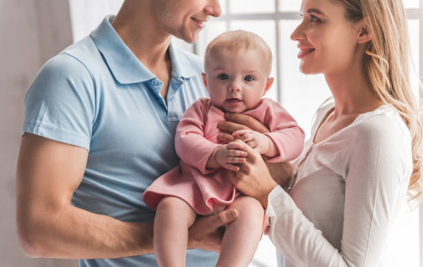 istock Young couple with baby 664044208