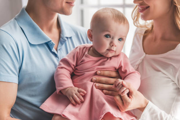 istock Young couple with baby 664047638