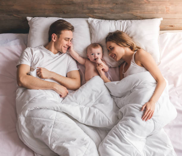 istock Young couple with baby 664047736