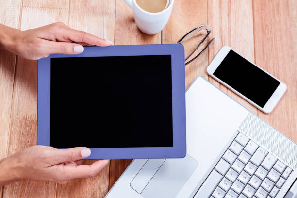 istock Overhead of feminine hands holding tablet 664048118