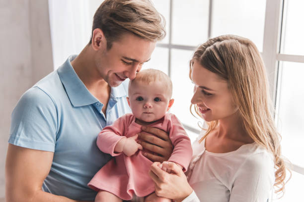 istock Young couple with baby 664050438