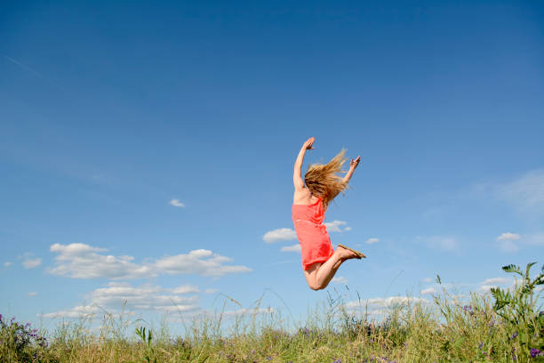 istock happy woman leaping 664051034