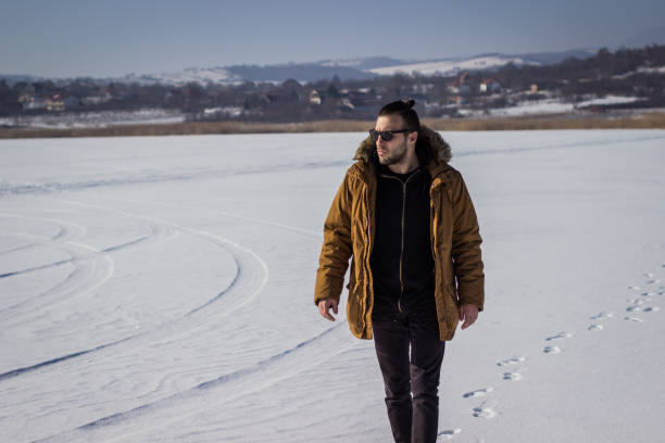 istock Man at frozen lake 664051644