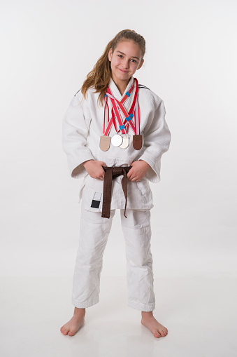 Teneger judo fighter girl white background