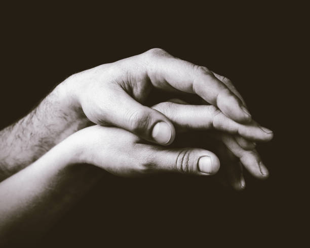 istock A gentle touch of two hands. 664055796