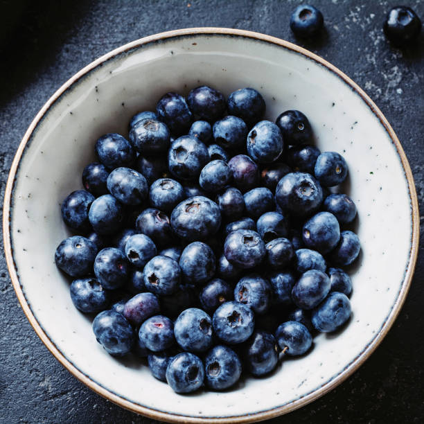 istock Blueberries in bowl closeup top view 664064660