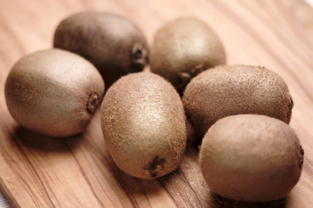 istock Kiwi fruits on an olive wood chopping board 664068048