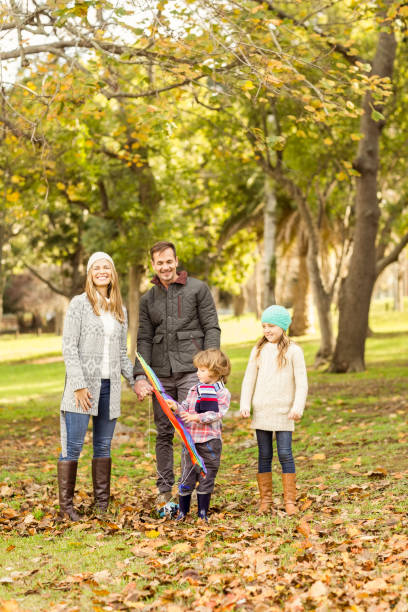 istock Young family playing with a kite 664071446
