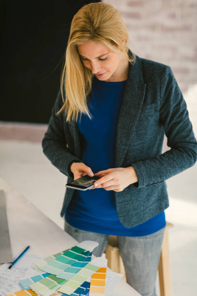 istock Pregnant woman Working in Her Office 664071716