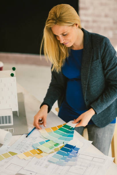 istock Pregnant woman Working in Her Office 664071722