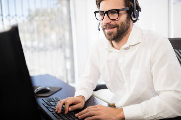 istock Businessman with glasses smiling and working 664074542