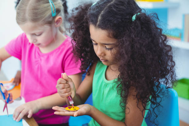 istock Girls making arts and crafts together 664075322