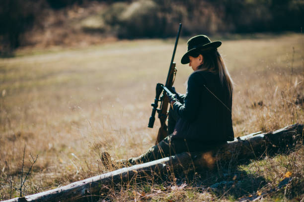 young woman hunting young woman, hunter, nature, hunting, spring female sharp shooter stock pictures, royalty-free photos & images
