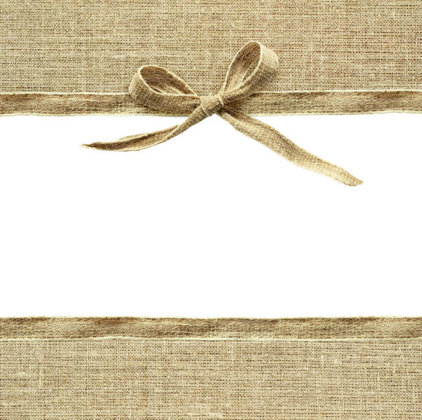 istock Beige canvas ribbon bow and textile borders 664087072