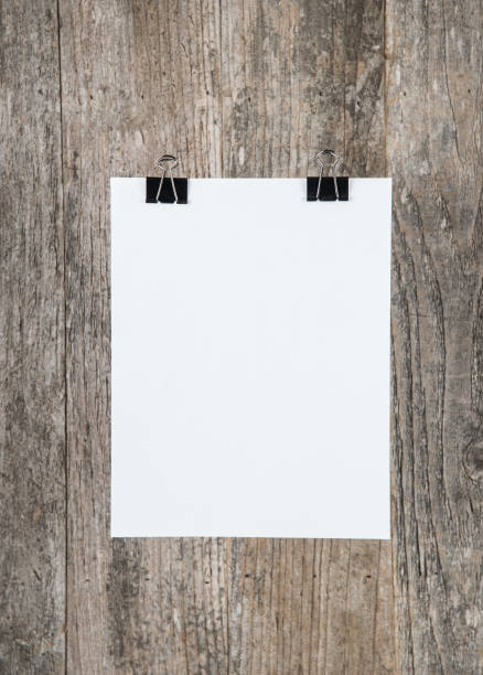 istock Paper on weathered wood background 664087716