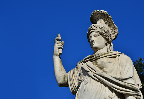Minerva as Goddess Roma neoclassical old marble statue in People's Square in Rome, made in the 19th century (with copy space)